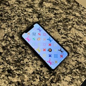 Apple iPhone X (10). Comes with glass screen protector and black leather case.